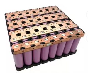 a battery using nickel copper sandwich method for connection, using purple cylindrical cells 