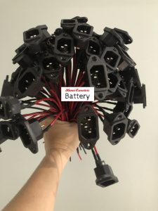 a bundle of t-type socket soldered with red and black cable around 20cm serving as charging port for ebike