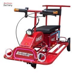 A mini e scooter from Vietnam in red colors, three seaters, the front angled.